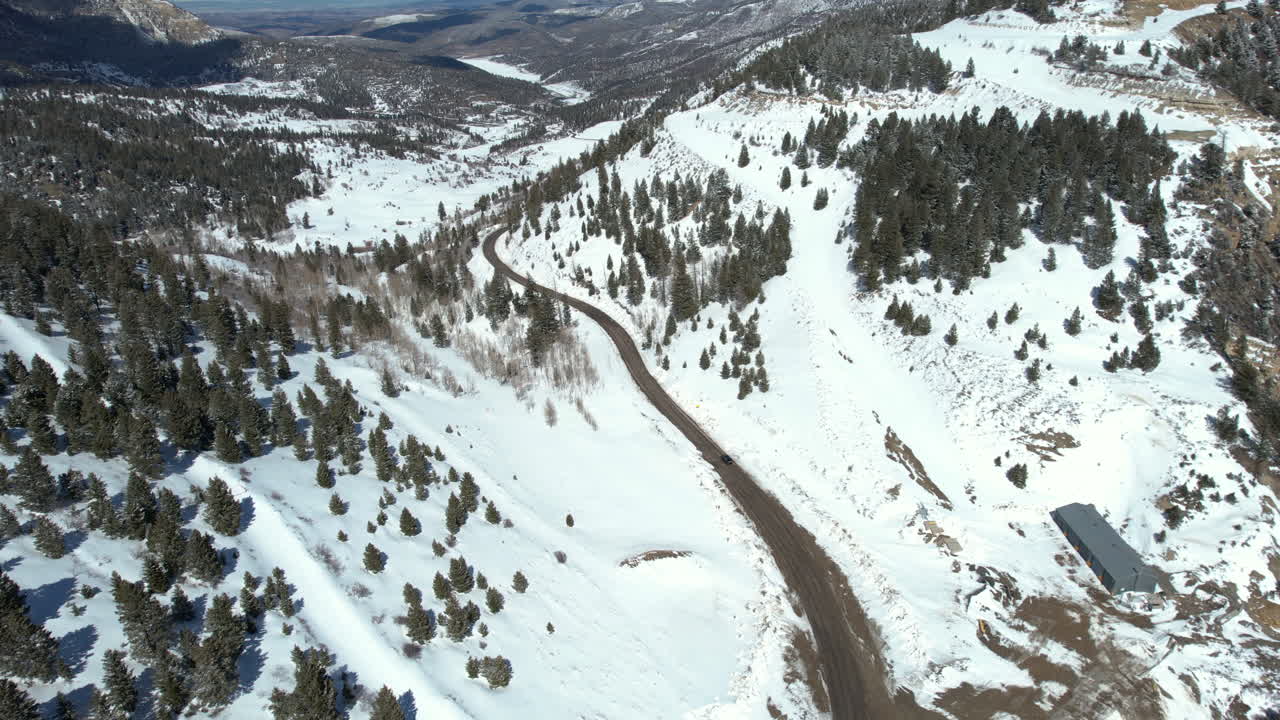 Aerial View of Dark Vehicle on Mountain Pass