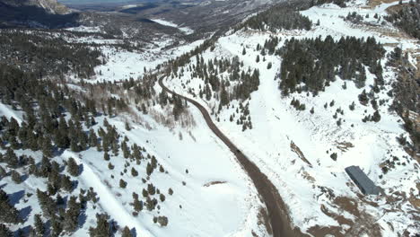 aerial view of dark vehicle on mountain pass