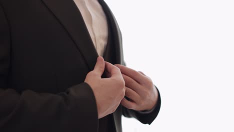 groom getting ready in his tuxedo suit