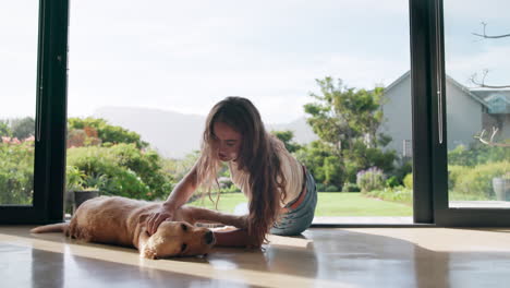 Woman petting her dog at home
