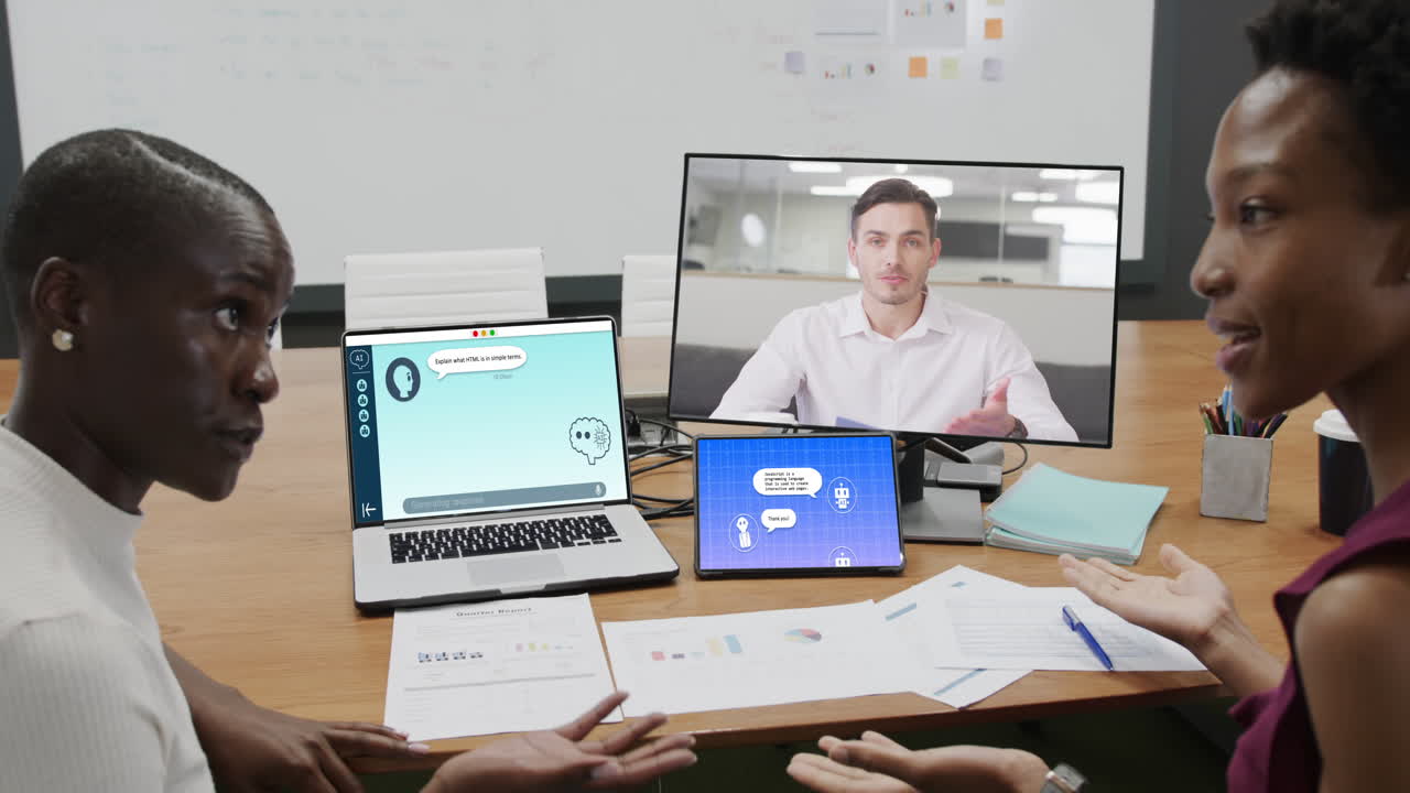 African american businesswomen on computer video call and talking in office