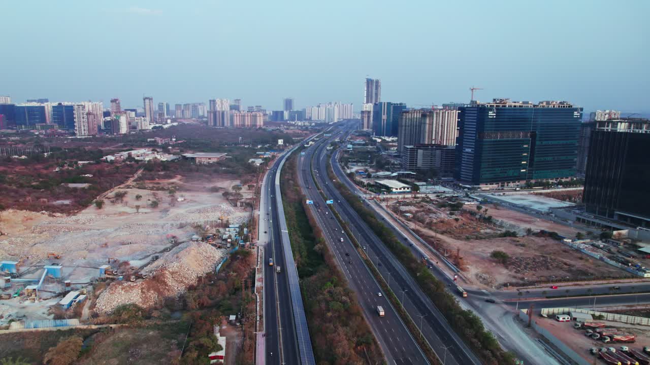 concrete mining with Solar cycle track, service road and ORR at nanakramguda, Financial District, hyderabad, telangana, india. day time, push in, drone shot, 4k.