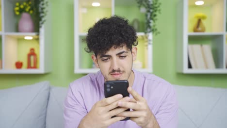 Young-focus-on-phone-texting-and-happy.