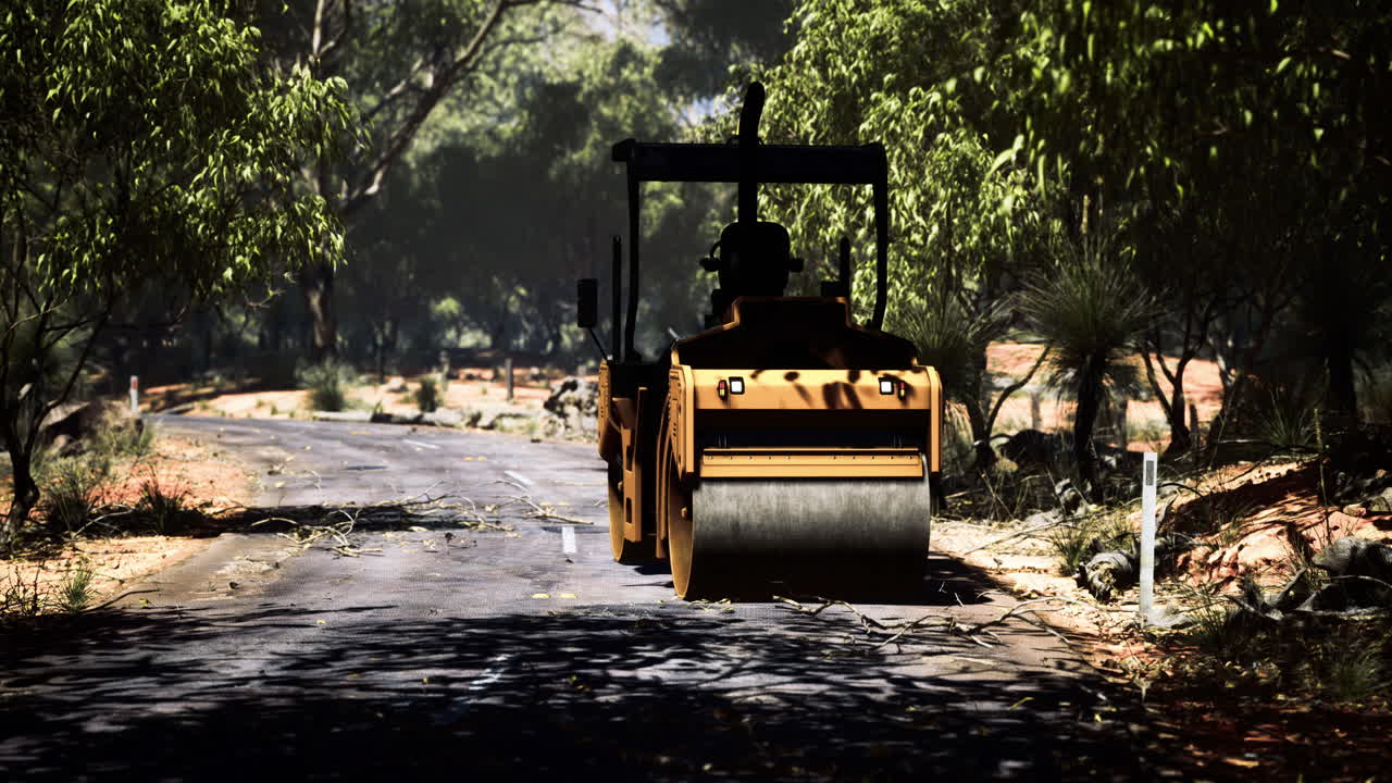 Construction equipment smooths freshly paved road in serene landscape