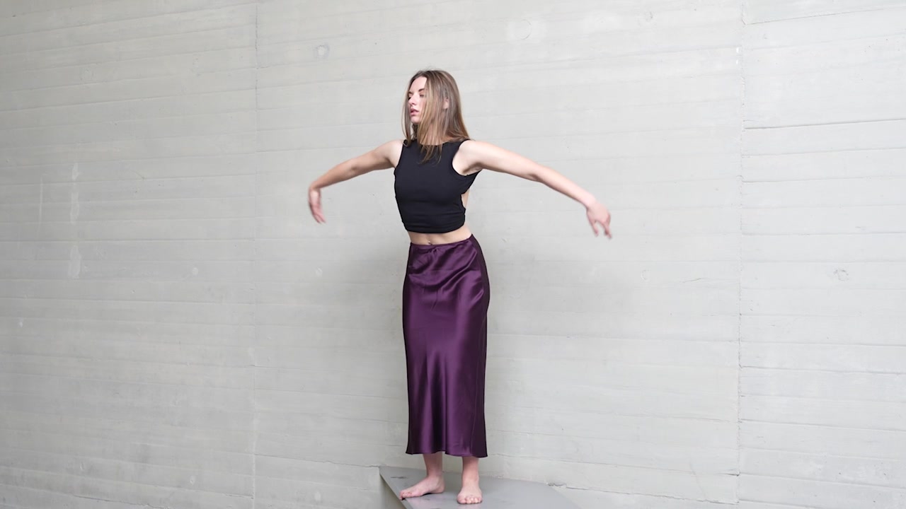 The contemporary dance expression takes place in a stylish urban setting with vibrant energy