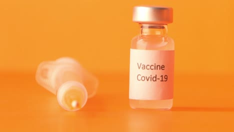 covid-19 vaccine vial and syringe