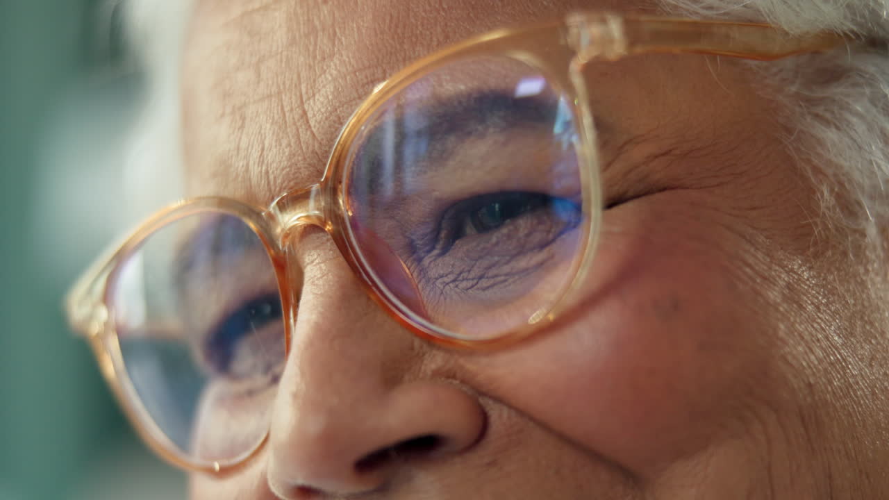 Close-up of an elderly woman wearing glasses