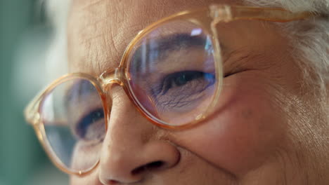 close-up of an elderly woman wearing glasses