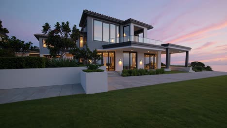 beautiful oceanfront villa for sale, featuring modern architecture, lush landscaping, and stunning sunset views, creating an idyllic setting for luxury living