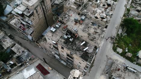 aerial view over the streets of a syrian city. some of the buildings are still in ruins after the civil war 10 years ago 4k