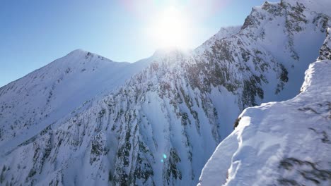the camera flies away from a big snow-covered white mountain