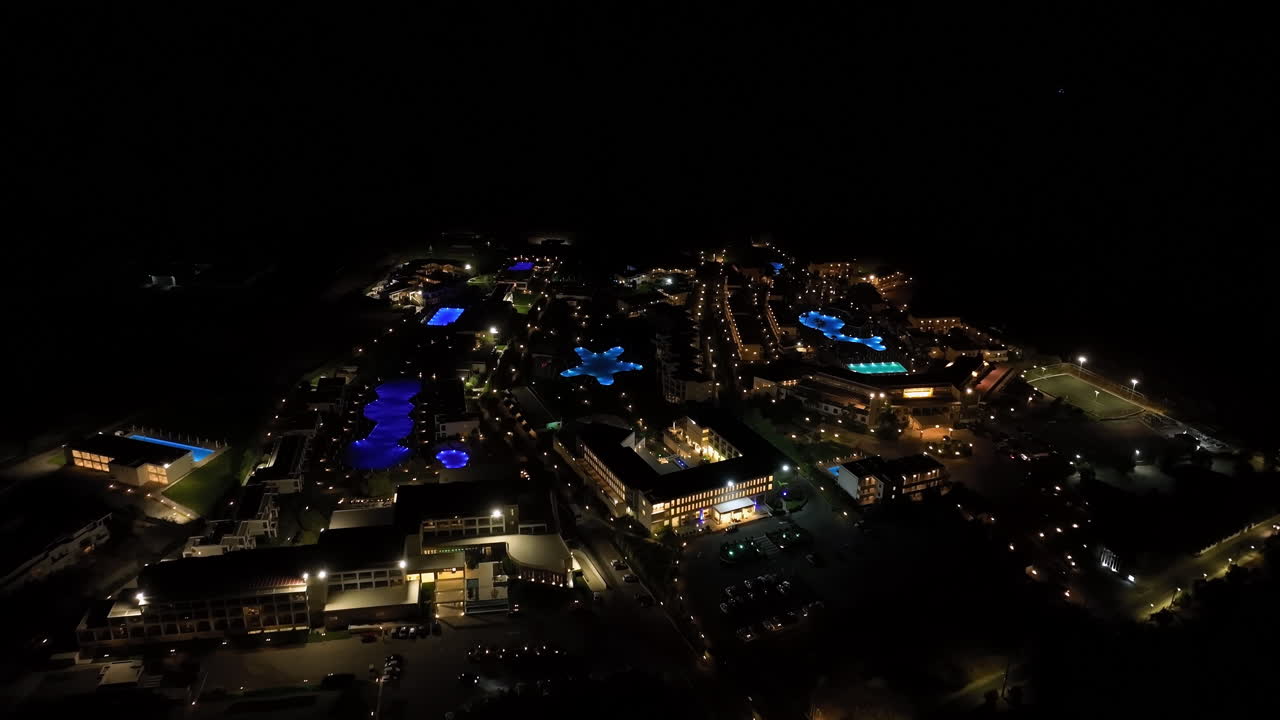 Aerial overview of luxury hotels at the coastline of Rhodes, night in Greece