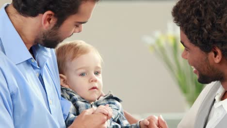 Gay-smiling-couple-with-their-kid