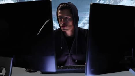 Animation of hooded man hacking a computer