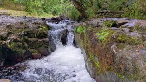 slow motion of small waterfall at sgwd clun-gwyn in brecon beacons wales uk