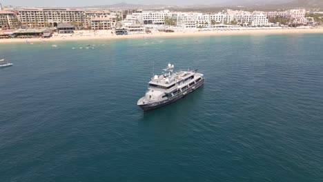 Aerial:-luxury-yacht-moored-in-tropical-bay-off-Cabo-San-Lucas,-Mexico