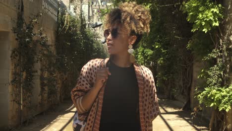 stylish woman on street in sunshine