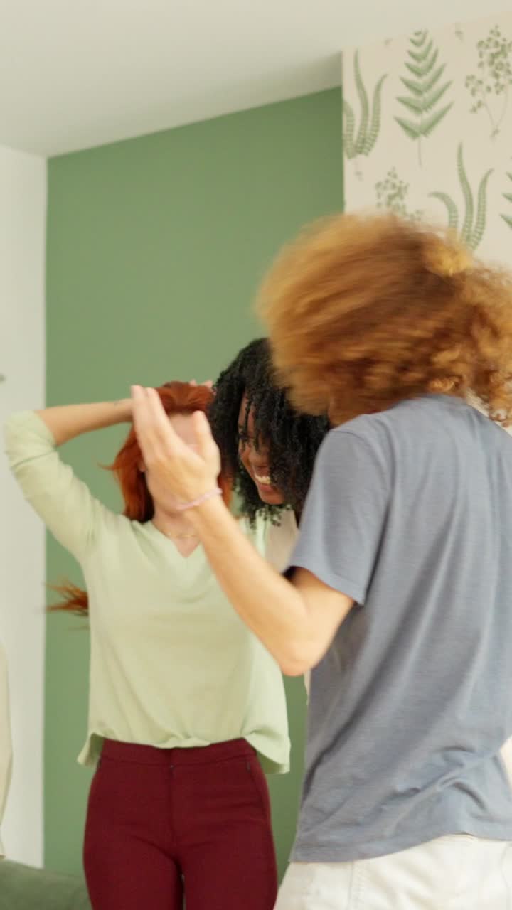 Guy and girl with afro hair embracing happily