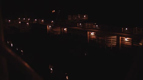 slow motion night shot of a dock filled with lights