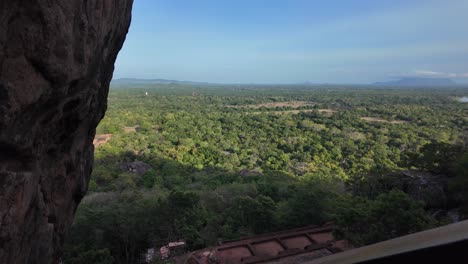 view of lush green forests from the heights of sigiriya lion rock. experience the beauty of sri lanka's iconic natural and cultural landmark from above.