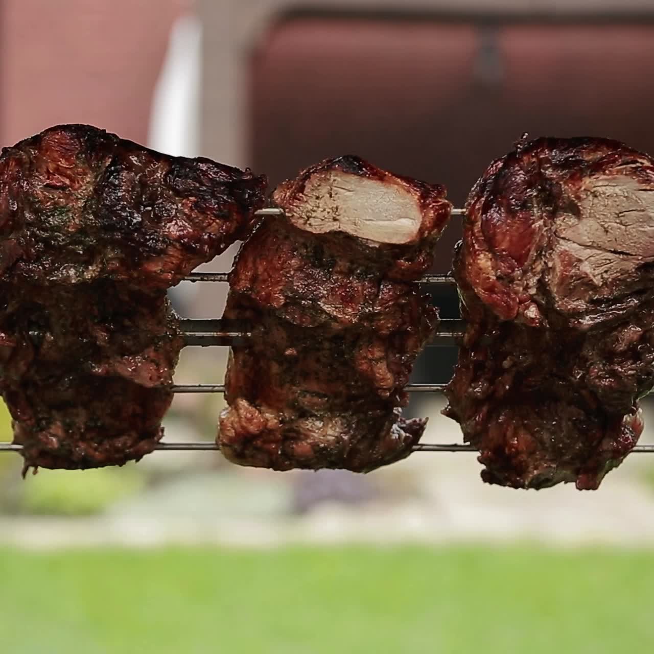 Grilling steaks with flames