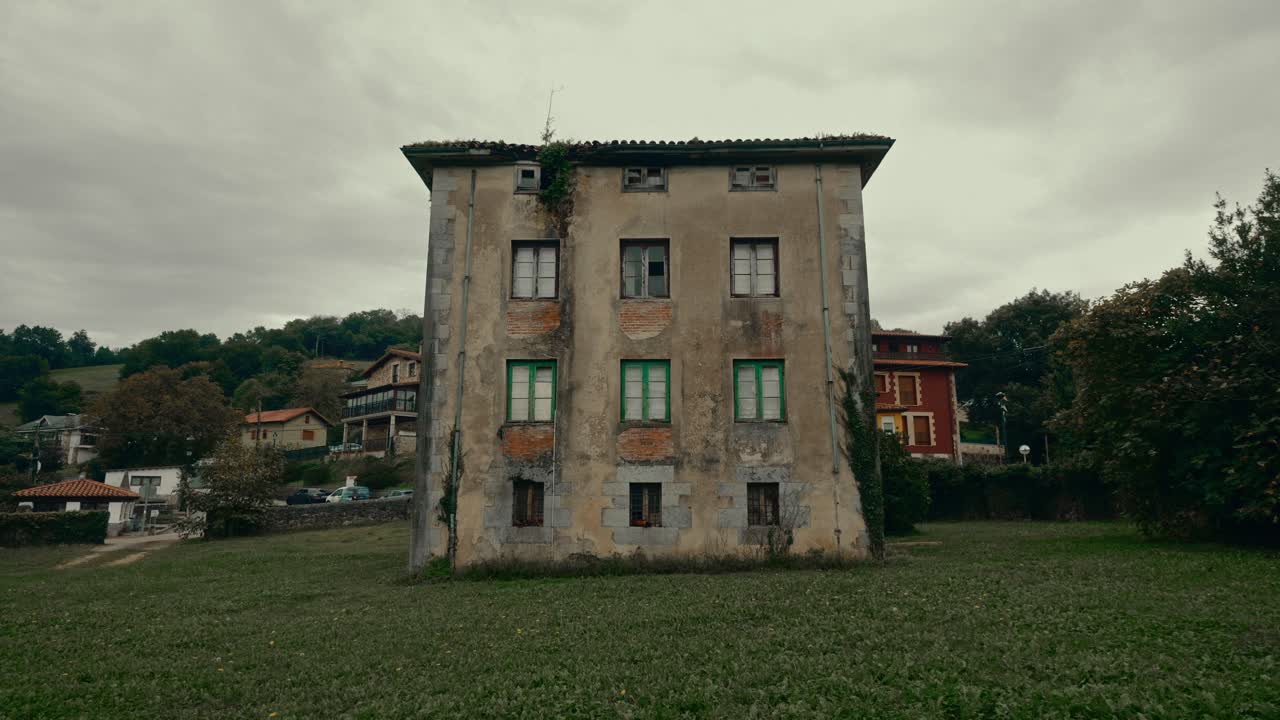 Historic Stone Building in a Rural Landscape on a Cloudy Day