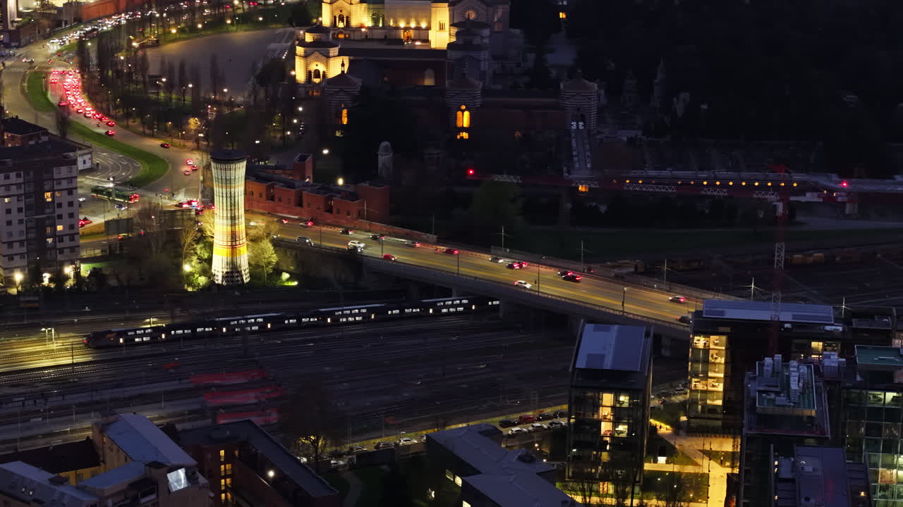 Aerial drone view of cars moving in traffic in Milan, Italy in the evening