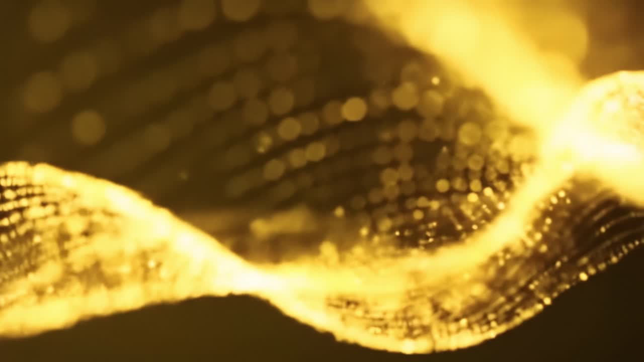 Beautiful golden waves flow gracefully, creating a calming atmosphere. The shimmering effect adds depth and movement, inviting viewers into a tranquil world.