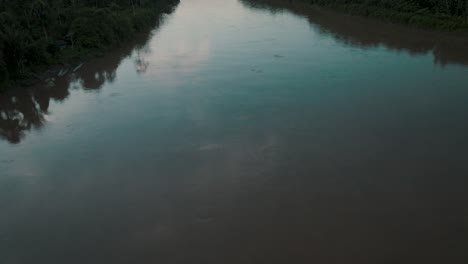 Drone-tilt-up-reveals-mighty-Amazon-river-surrounded-by-pristine-rainforest