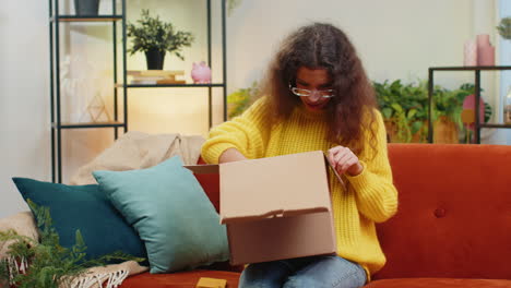 angry dissatisfied shopper child girl kid unpacking parcel feeling upset confused wrong delivery