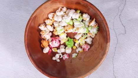 colorful popcorn in a wooden bowl