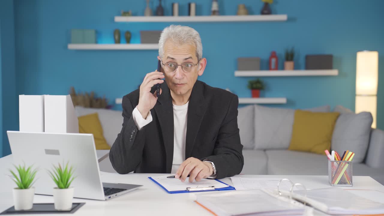Home office worker man receives good news.