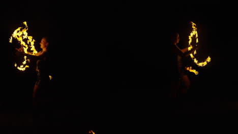 fire dancers at night