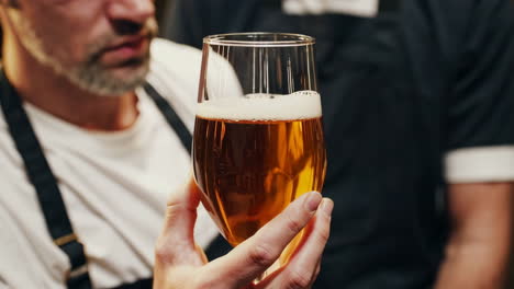 brewery employees tasting beer
