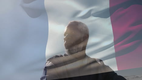 man looking into distance over waving flag animation