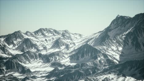 aerial view of the alps mountains in snow