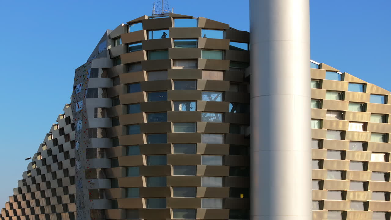 Aerial drone view of CopenHill artificial ski slope on the roof of an energy plant