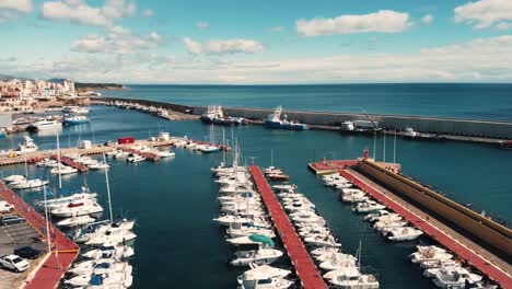 Zoom-in-at-Port-of-Ametlla-de-Mar-in-Tarragona,-Catalonia,-Spain-at-daytime---Aerial-View