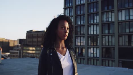 Fashionable-young-woman-on-urban-rooftop