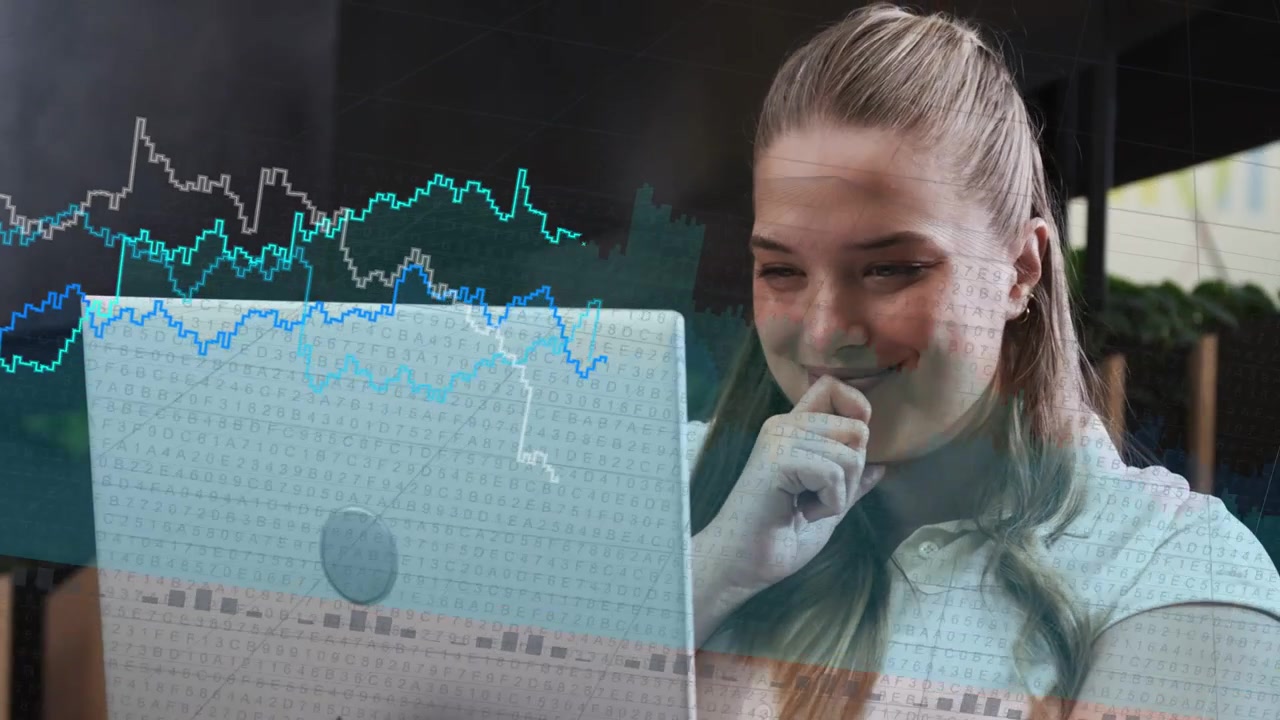 Woman sitting on soft seat using laptop overlaying charts as clip playing analyzing IT trends