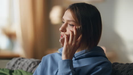 Woman talking on the phone indoors