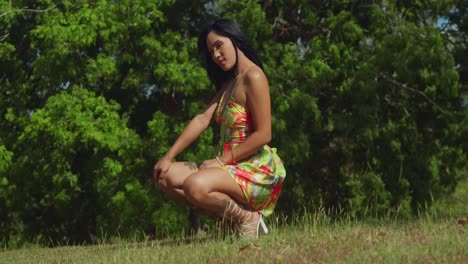 a latina girl in a dress discovers happiness in a beautiful park on trinidad island