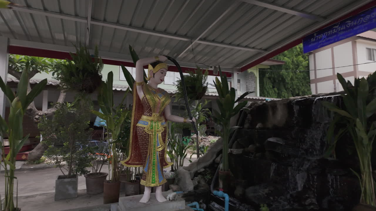 A Statue Of Lady Buddha In The Garden Of Wat Muen Ngoen Kong In Chiang Mai, Thailand. POV Shot