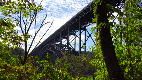 Low-angle-establishing-shot-of-the-New-River-Gorge-Bridge-in-West-Virginia