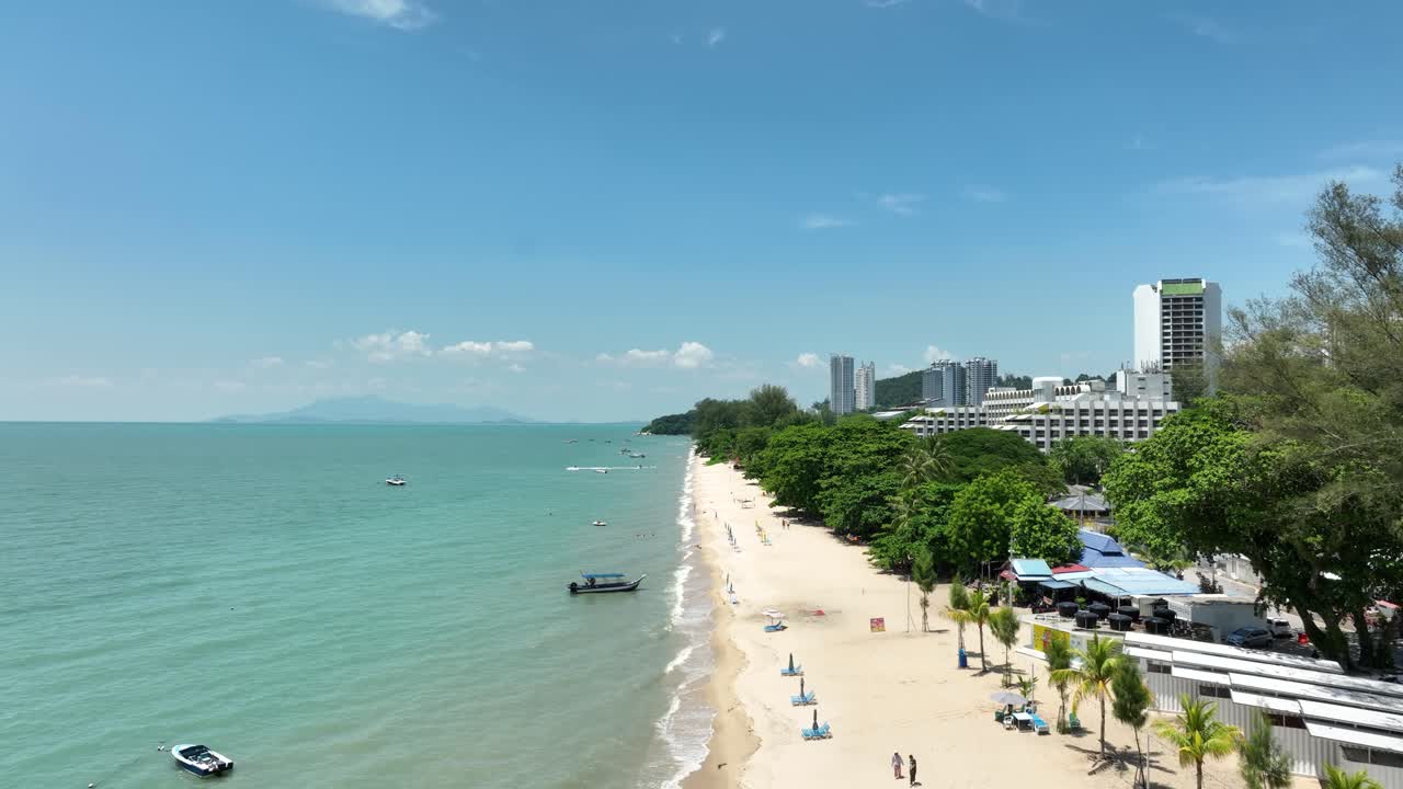Golden sands where waves kiss the shore, Batu Ferringhi, come and explore