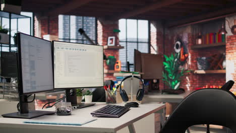 pc display on startup office desk showing programming languages