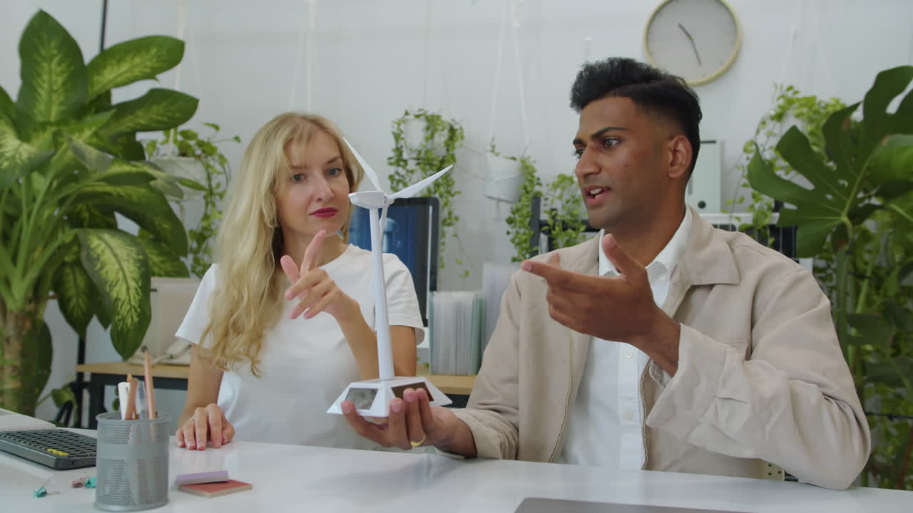 Couple of Industrial Engineers Discussing New Model of Wind Turbine