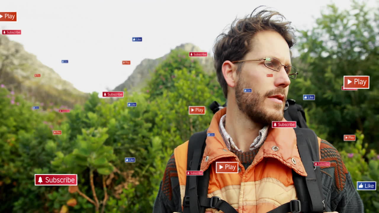 Male hiker trekking forested hillside, with floating subscribe, like and play icons for marketing
