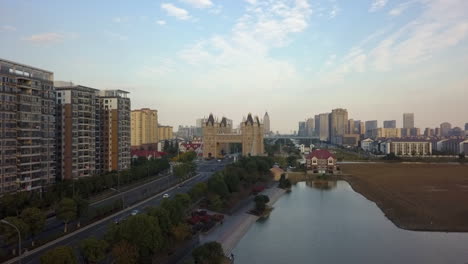 rising aerial toward replica tower bridge along canal in suzhou china