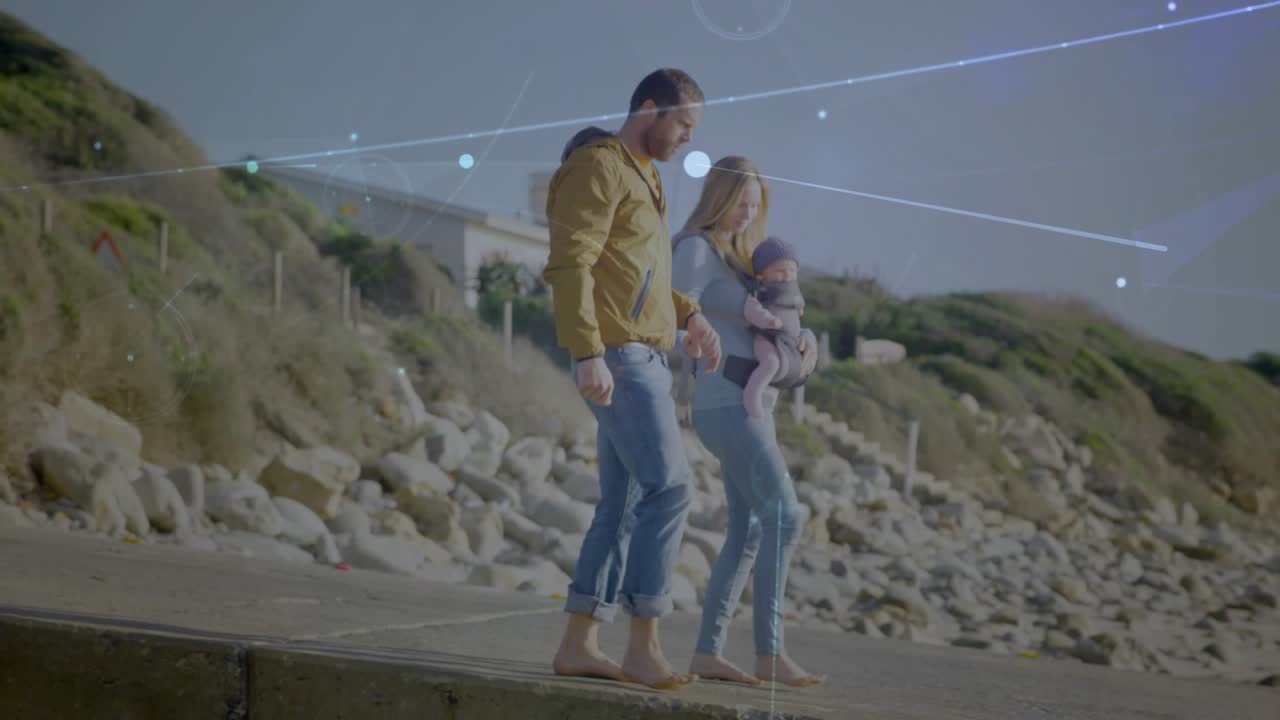Famiglia che passeggia con un bambino lungo i gradini della costa, con sovrapposizioni tecnologiche di linee e punti che attraversano il trio in cammino.
